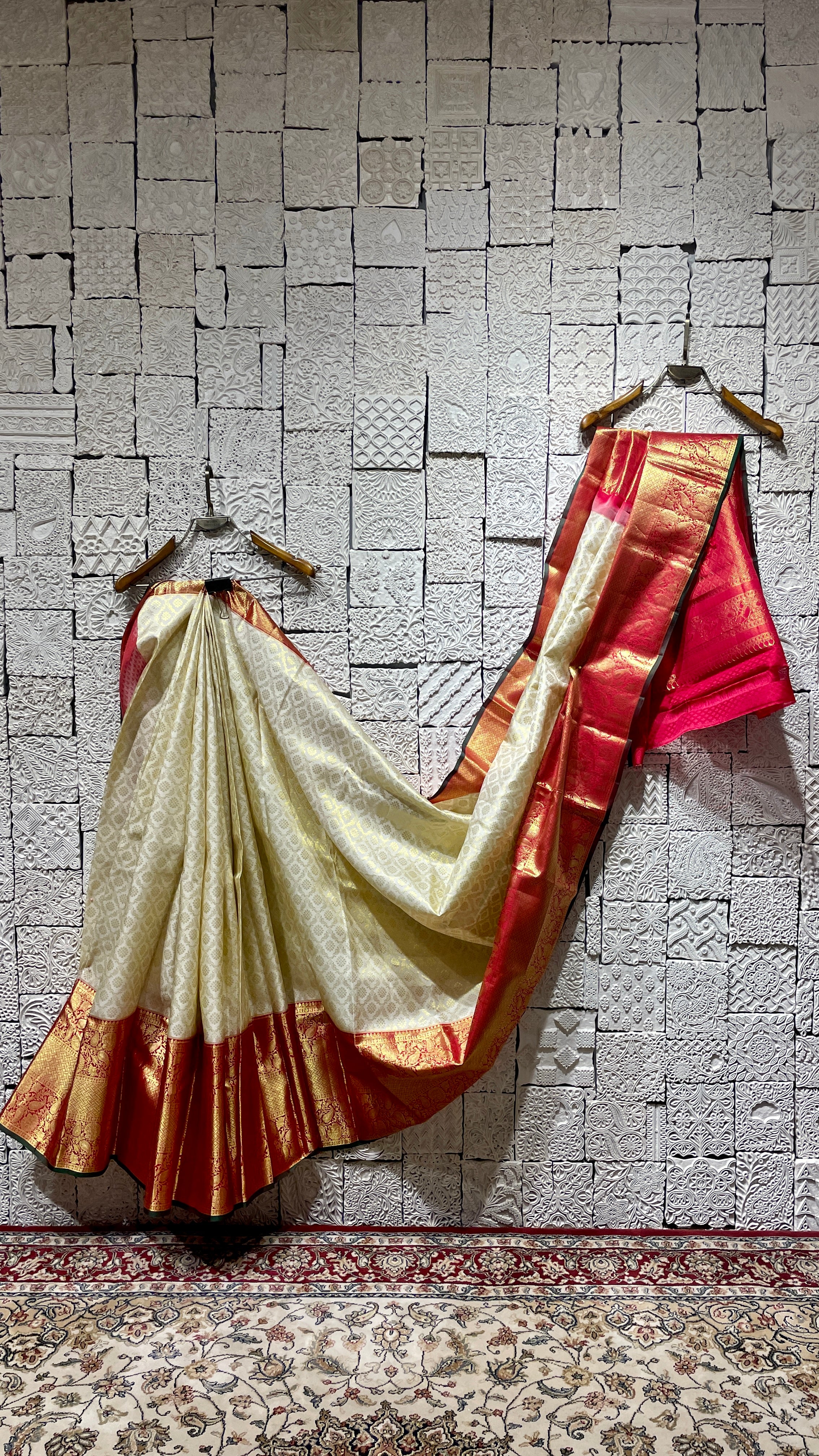 Cream silk kanjivaram saree with red border