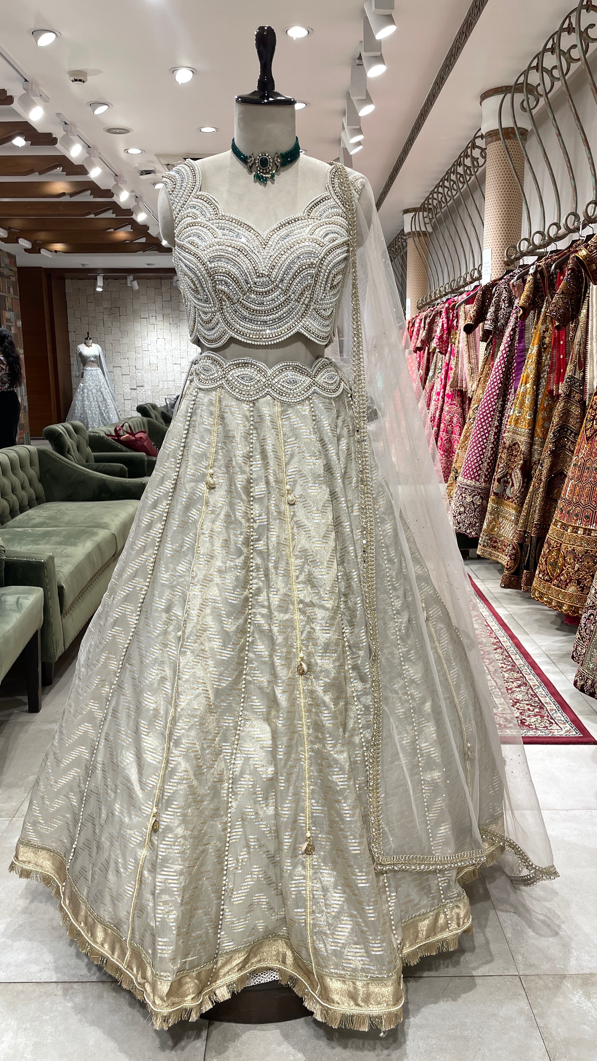 Ivory tissue lehenga with heavy embellished blouse