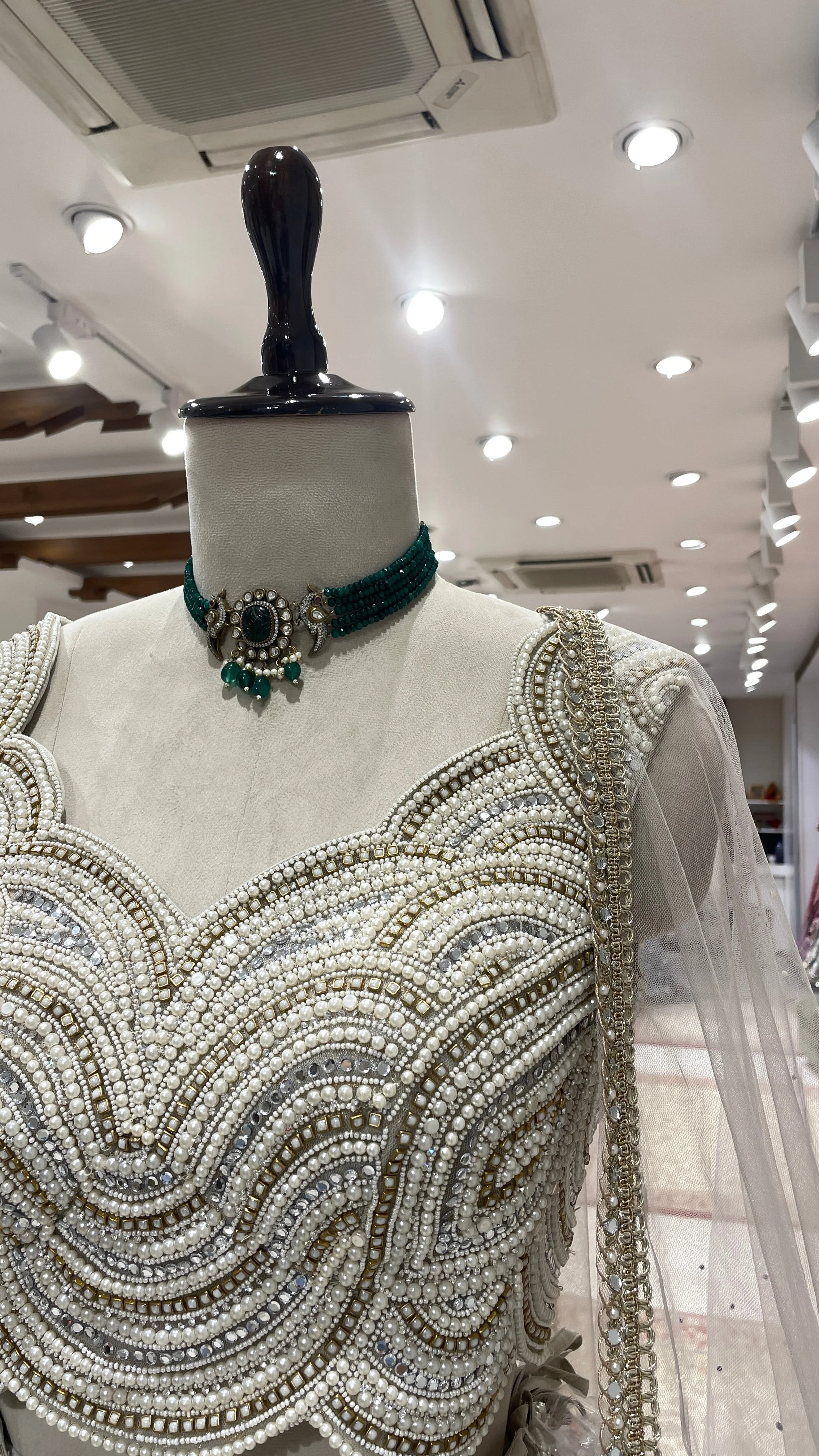 Ivory tissue lehenga with heavy embellished blouse - Image 5