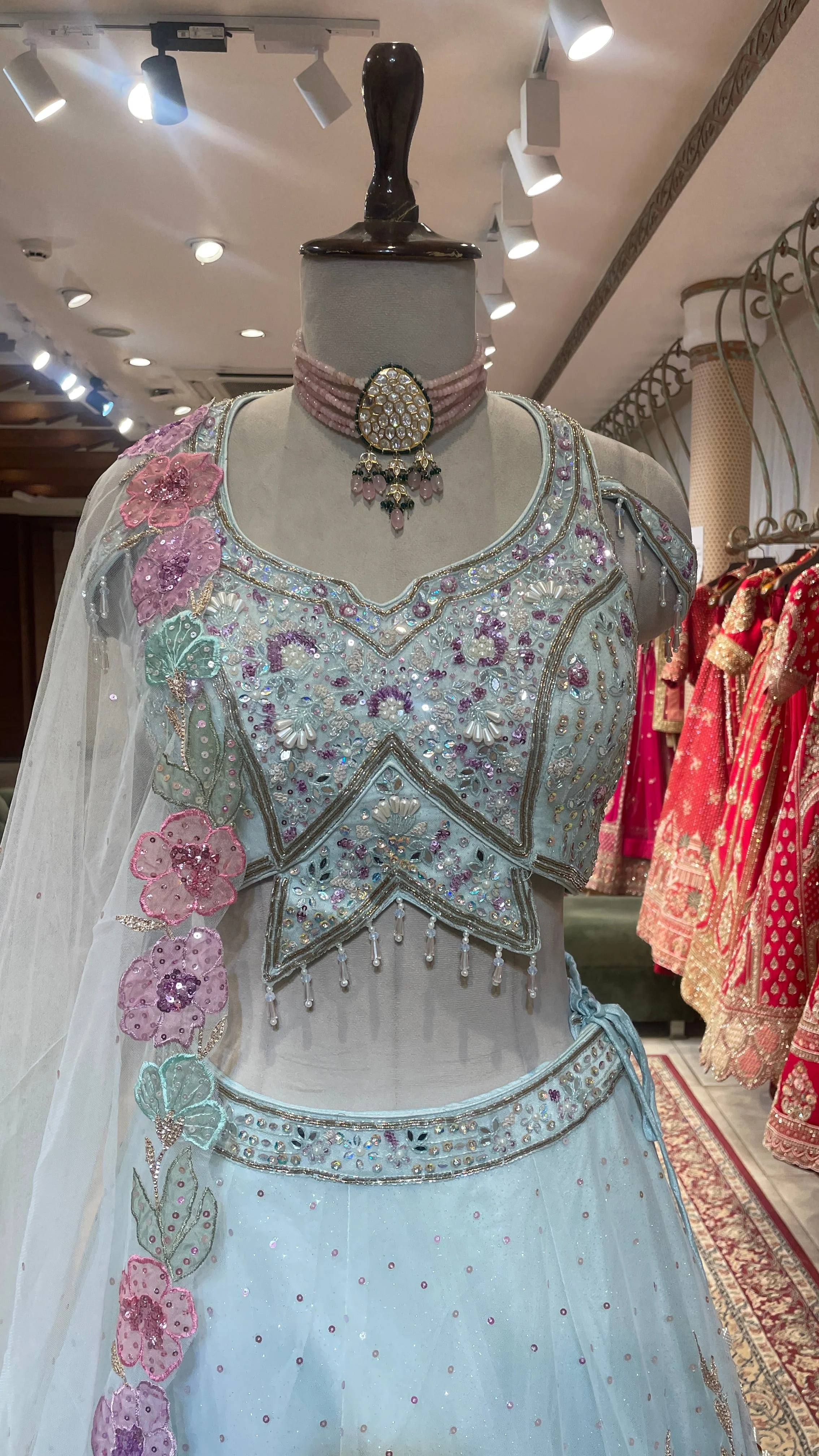 Pastel blue net lehenga with floral motifs - Image 5