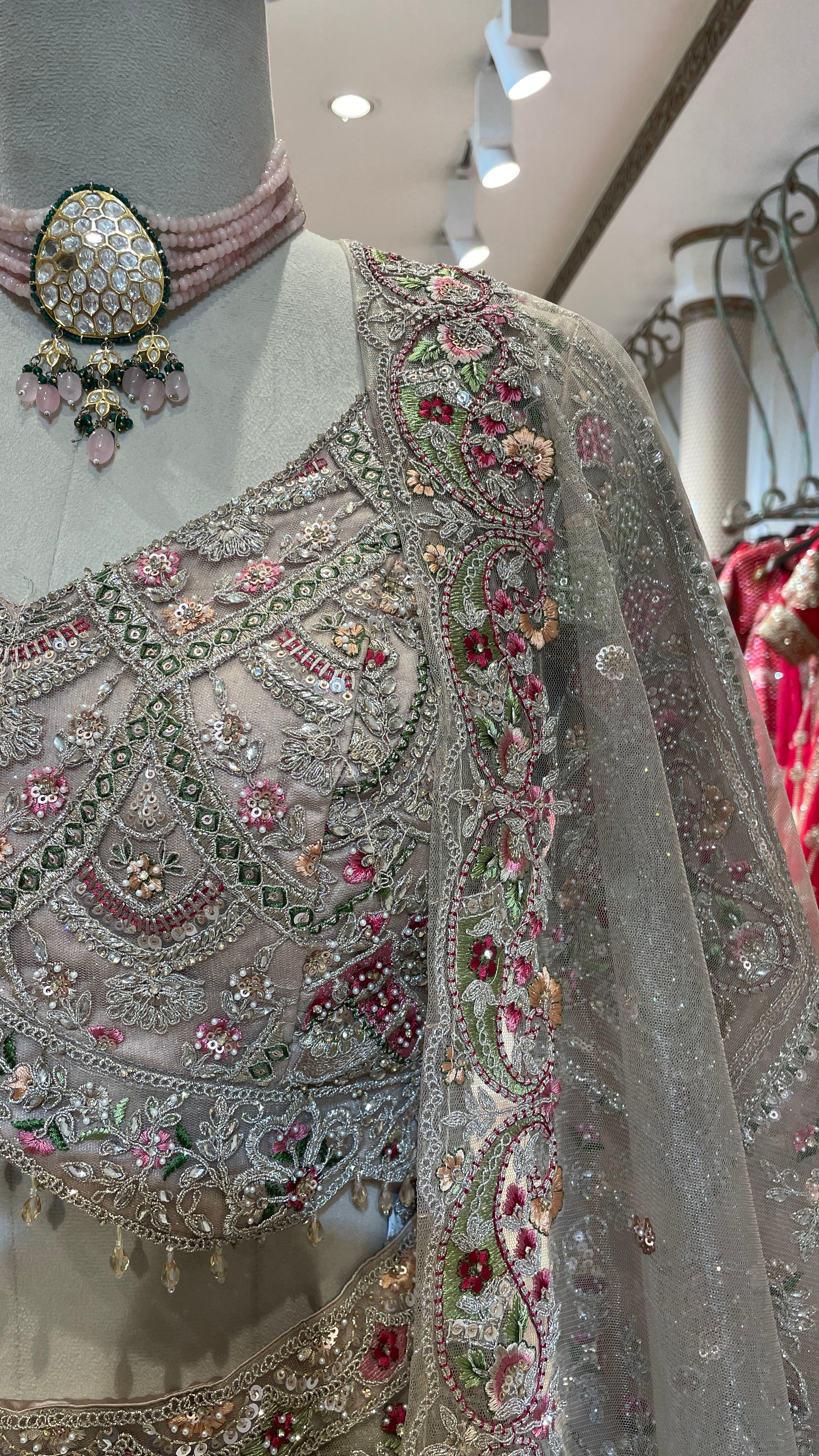 Peach net lehenga with multicolour threadwork and embellishments - Image 2