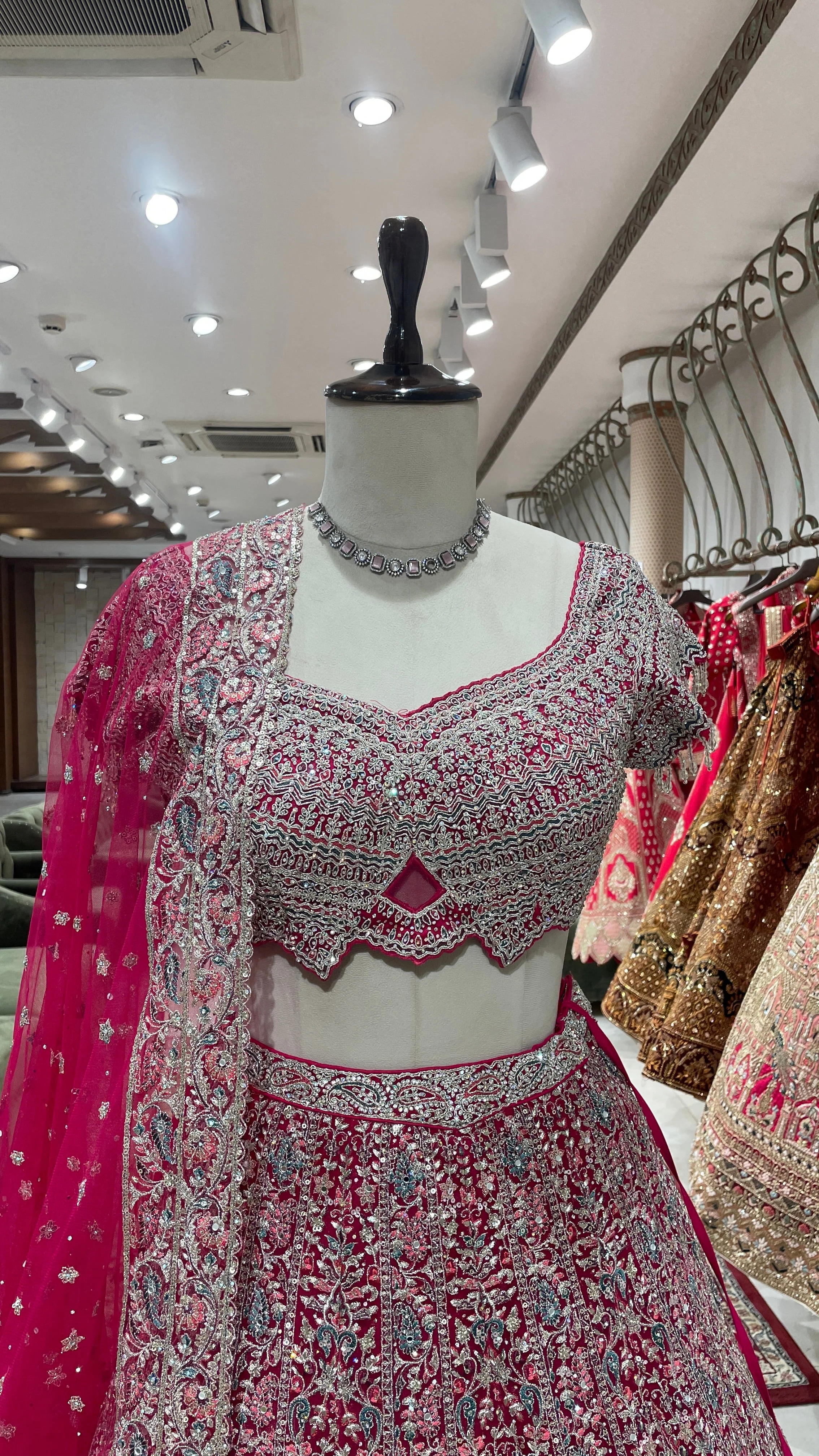 Pink net lehenga with floral motifs - Image 5