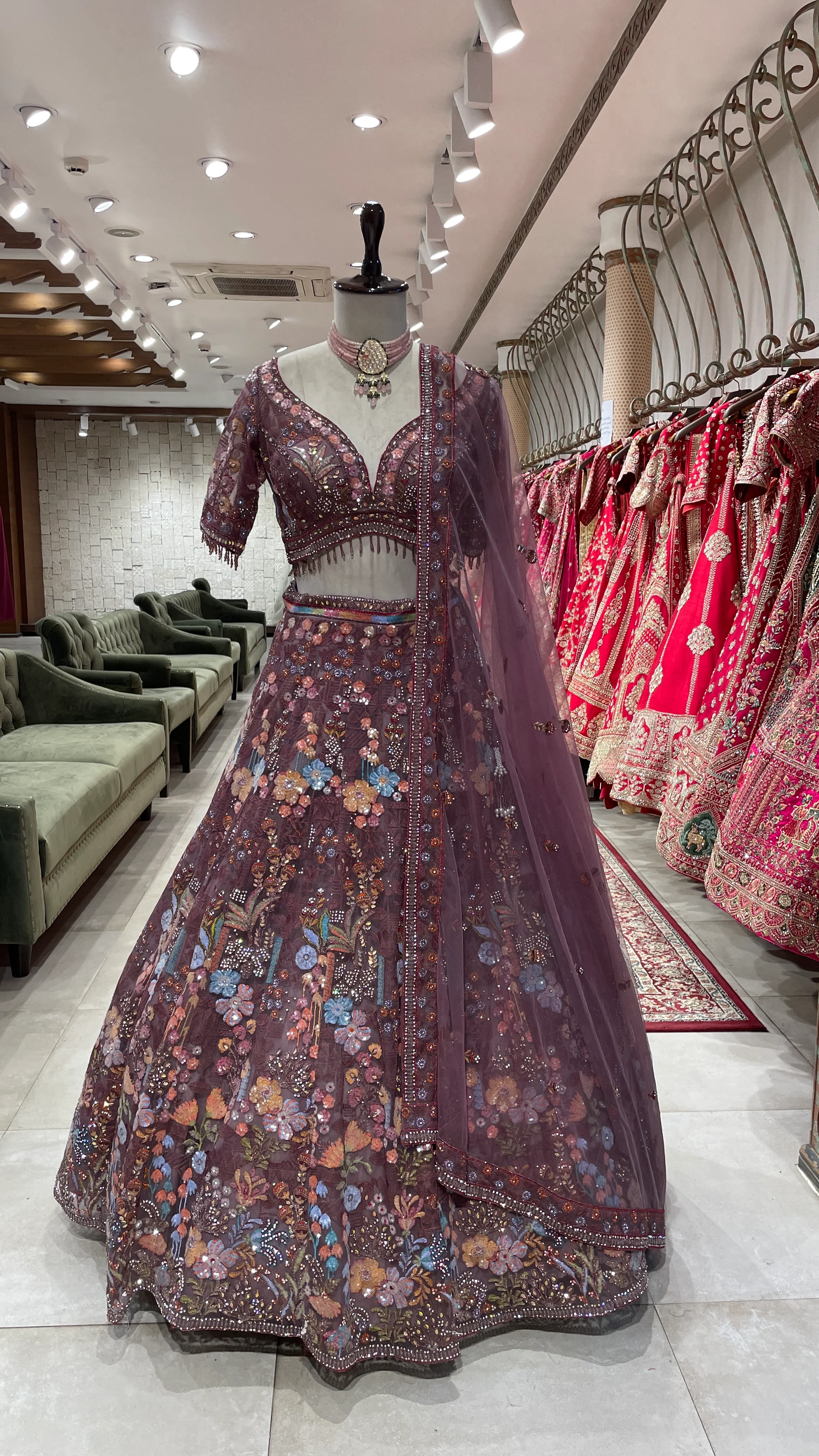 Rust colour Lehenga with multicolour thread and sequins work
